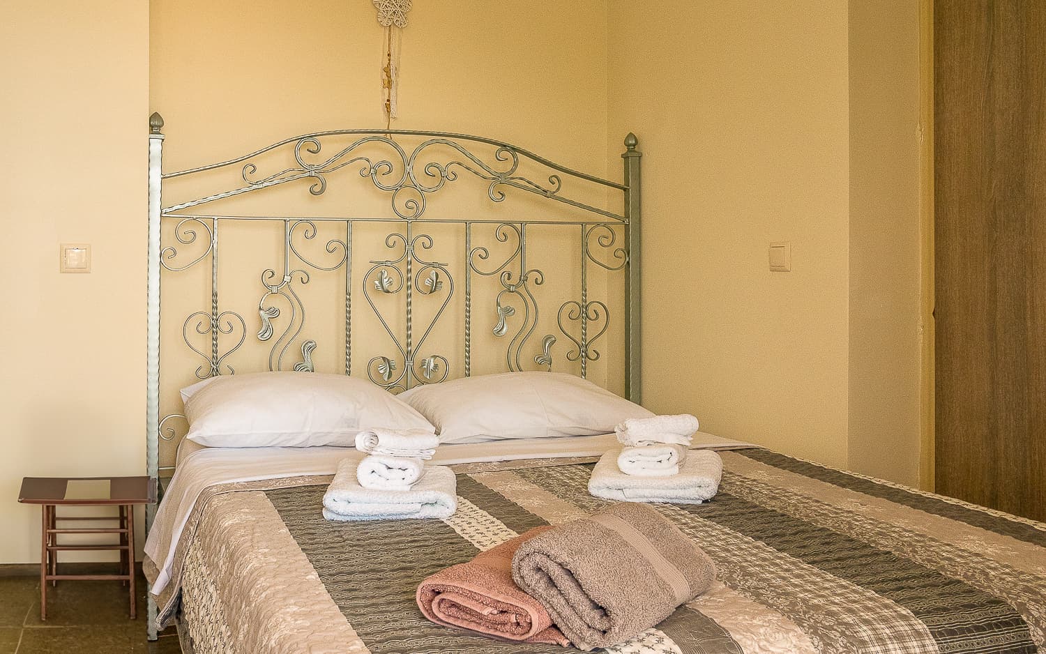 First bedroom at Sun And Stone with comfortable bed arrangement